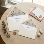 Boho celestial floral wedding invitation suite with custom envelope liners by Wrapped Studios.