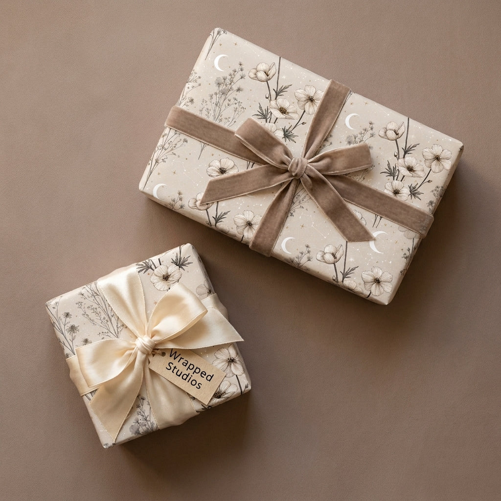 Luxury celestial floral wrapping paper with velvet ribbons on gift boxes, by Wrapped Studios.