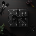 Elegant black gift wrap with silver floral design, tied with a satin ribbon and a "Special Gesture" tag.