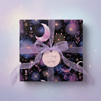 Elegant gift wrapped in purple floral wrapping paper with a "Wishing You Stars" tag and sheer ribbon.