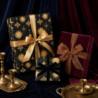 Luxury celestial wrapping paper with gold sun and moon patterns by Wrapped Studios.