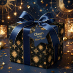 Luxury celestial New Year wrapping paper in navy and gold with a satin bow by Wrapped Studios.