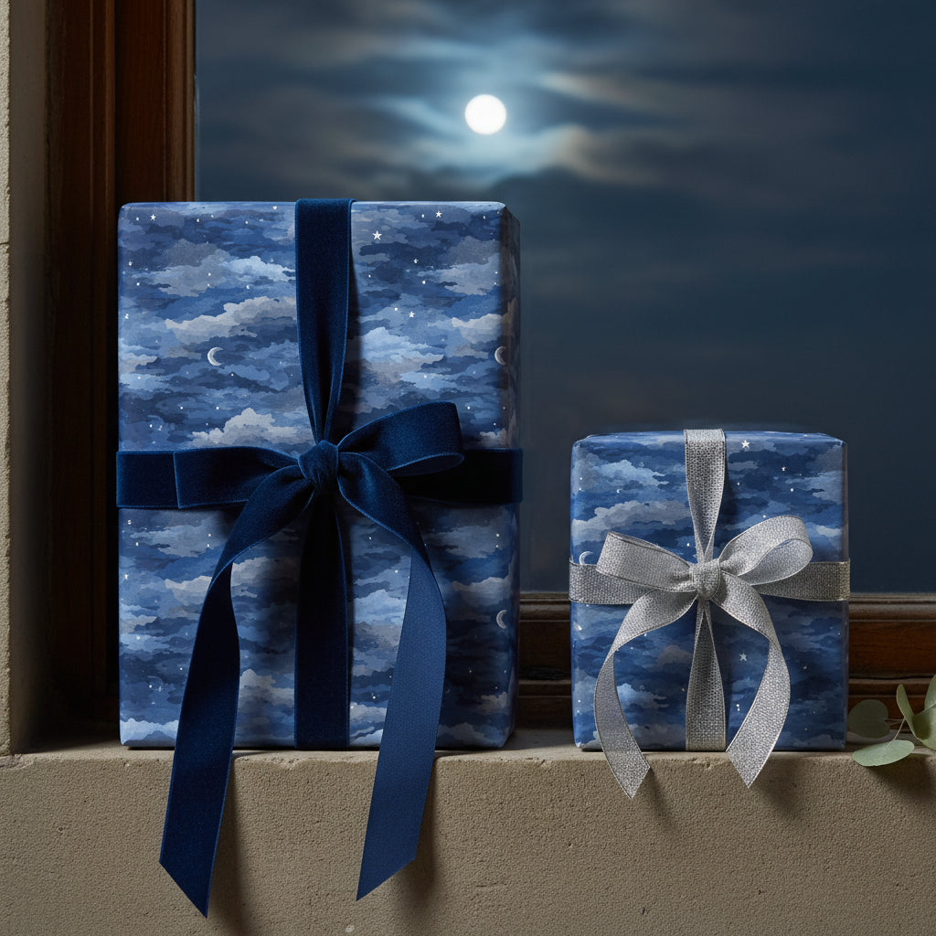 Wrapped gifts with navy celestial wrapping paper and velvet ribbon against a night sky backdrop.