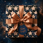 Celestial star wrapping paper by Wrapped Studios with a luxury bronze satin ribbon and Shine Bright tag.