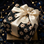 Luxury Christmas wrapping paper with navy and gold star pattern and cream ribbon by Wrapped Studios.