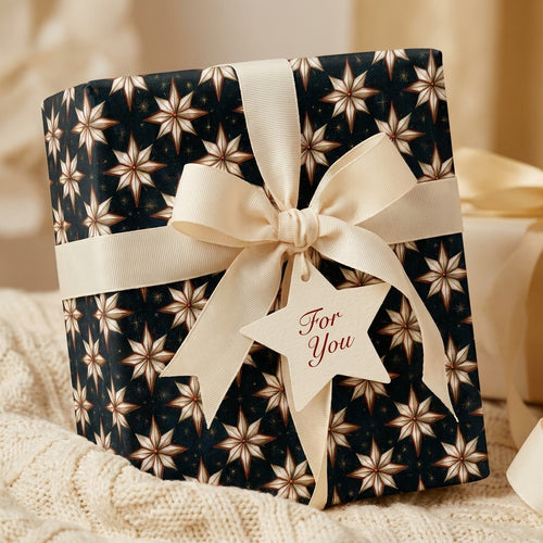 Luxury star Christmas gift wrap with ivory ribbon and gift tag by Wrapped Studios.