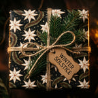 Winter Solstice wrapping paper with a luxury star pattern, twine, and pine sprig, by Wrapped Studios.