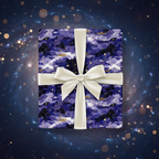 Elegant gift wrapped in navy star wrapping paper with a cream ribbon, perfect for a birthday or holiday present.
