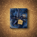 Elegant navy & gold gift wrapped in luxury marble-patterned paper with a satin ribbon bow.