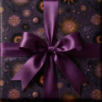 Luxury celestial wrapping paper in dark purple with gold starbursts and a satin bow, by Wrapped Studios.