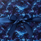 Navy satin ribbon tops starry blue galaxy wrapping paper, perfect for elegant gifts.
