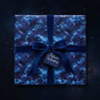 Square gift wrapped in elegant blue galaxy wrapping paper with velvet ribbon and bow.