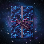 Wrapped gift box in galaxy wrapping paper with purple ribbon and "Stellar Gift" tag.
