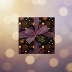 Elegant gift box with spiral pattern wrapping paper, tied with a sheer purple ribbon and "A Little Something Special" tag.