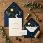 Celestial wedding invitation suite featuring navy and gold sun and moon envelope liners by Wrapped Studios.