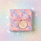 Pastel moon & stars birthday wrapping paper with pink ribbon and "Wishing Upon a Star" tag.
