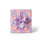 Pastel galaxy wrapping paper with moons and stars, tied with lavender satin ribbon.