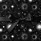 Black celestial wrapping paper featuring suns, moons and stars with satin bow.