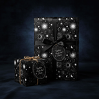 Elegant gifts wrapped in celestial wrapping paper with a black ribbon and "Together Under the Stars" tag.