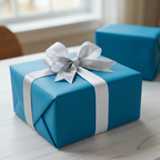Teal gift box wrapped in solid color paper with silver ribbon and bow for birthday, Christmas or any occasion.