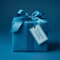 Elegant solid blue gift wrapping paper with satin ribbon bow and tag, perfect for birthdays or special occasions.