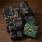 Chalkboard math and science wrapping paper on gifts with twine bows by Wrapped Studios.