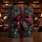Graduation gift wrap with chalkboard math design, burgundy bow, and class tag by Wrapped Studios.