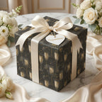 Luxury black and gold champagne gift wrap with a cream satin bow for weddings, by Wrapped Studios.