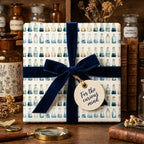 Science gift wrap with watercolor chemistry flasks and a navy velvet ribbon by Wrapped Studios.