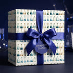 Science wrapping paper with watercolor chemistry beakers and a royal blue satin bow by Wrapped Studios.