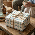 Science wrapping paper with watercolor chemistry flasks on a rustic gift box by Wrapped Studios.