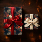 Luxury navy floral wrapping paper on gifts with red satin and cream velvet bows by Wrapped Studios.