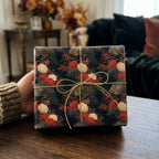 Luxury vintage floral wrapping paper with gold bow for elegant Christmas gift wrap by Wrapped Studios.