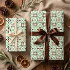 Sage green vintage floral wrapping paper on rustic gifts with elegant bows by Wrapped Studios.