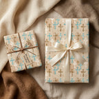 Christian baptism gift wrap with gold and teal crosses, tied with satin ribbon by Wrapped Studios.
