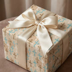 Baptism wrapping paper with elegant blue and gold crosses and ivory satin bow by Wrapped Studios.