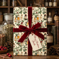Vintage Christmas wrapping paper with apothecary design and red velvet ribbon by Wrapped Studios.