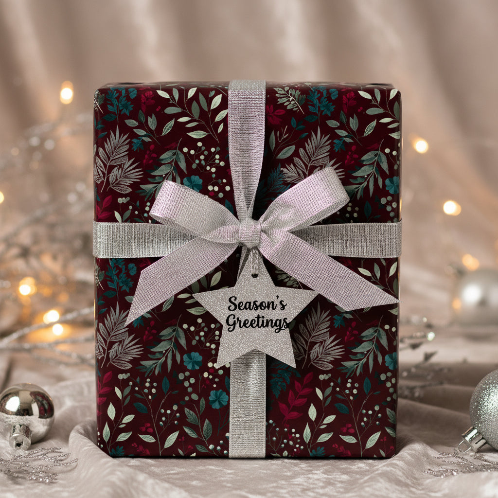 Burgundy Christmas gift wrap with silver ribbon, floral pattern, and "Season's Greetings" tag.