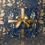Elegant navy gift wrapped in gold floral wrapping paper, tied with a gold satin ribbon and "With Love" tag.