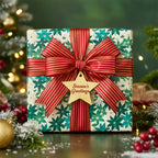 Christmas gift wrapped in floral wrapping paper with a red and gold ribbon and "Season's Greetings" star tag.