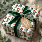 Cactus Christmas wrapping paper by Wrapped Studios on a gift box with a green velvet bow.