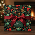 Elegant Christmas gift wrapped in festive floral paper with a red satin bow and “Cheers!” tag.