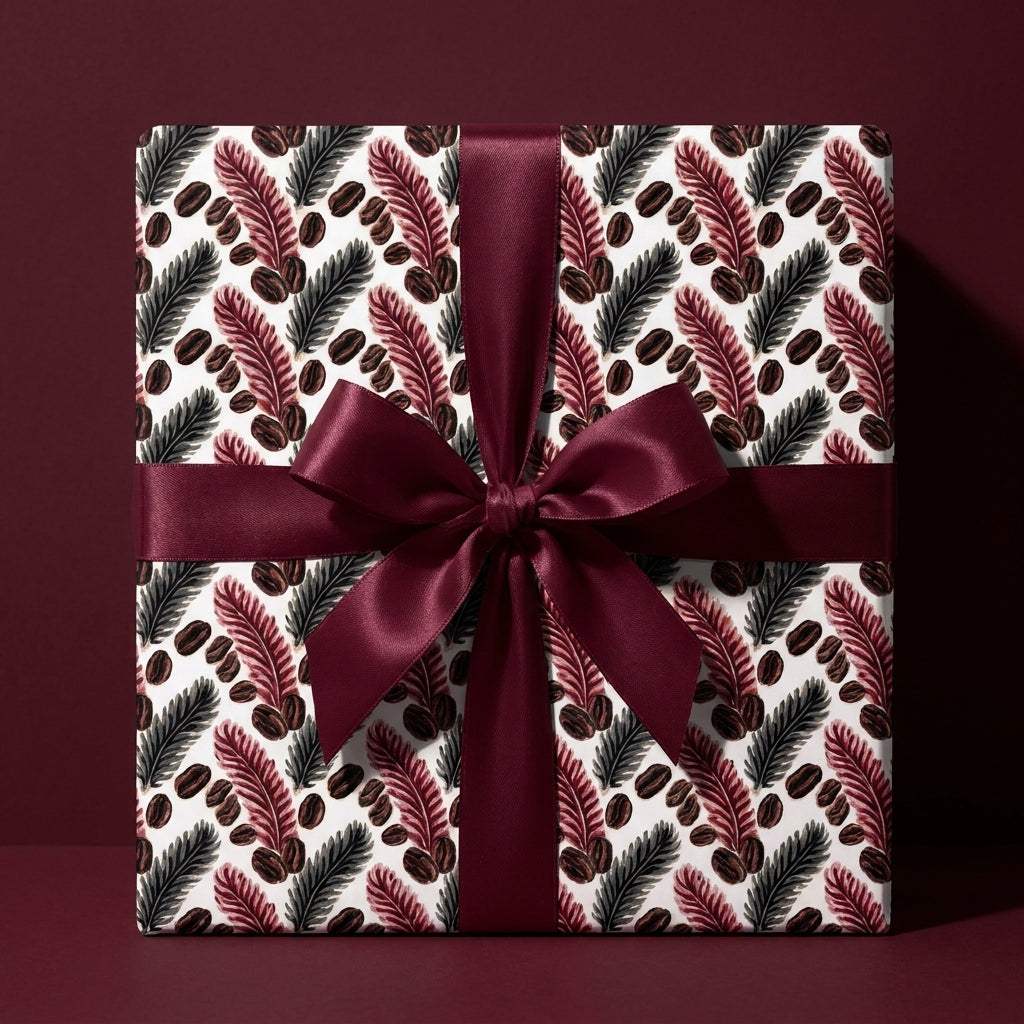Luxury holiday gift wrap with botanical pattern and burgundy bow by Wrapped Studios.