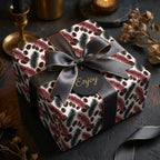Luxury botanical wrapping paper with a black satin bow and 'Enjoy' gift tag by Wrapped Studios.