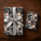Elegant Christmas gift wrap featuring floral ornament pattern and a silver satin bow.