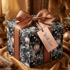 Elegant Christmas gift with black floral wrapping paper and copper ribbon.