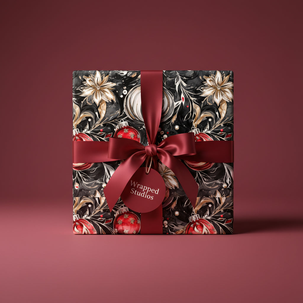 Wrapped Studios Christmas gift with elegant floral wrapping paper and burgundy ribbon.