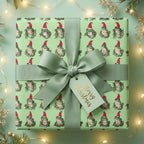 Cute frog Christmas wrapping paper with a sage ribbon and Merry Christmas tag, by Wrapped Studios.
