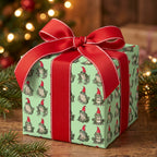 Cute frog Christmas wrapping paper with a red ribbon by Wrapped Studios.