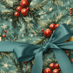 Teal Christmas gift wrap with pine sprigs, red berries, snowflakes, and matching satin bow.